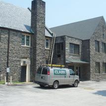 Utility Van Servicing Building
